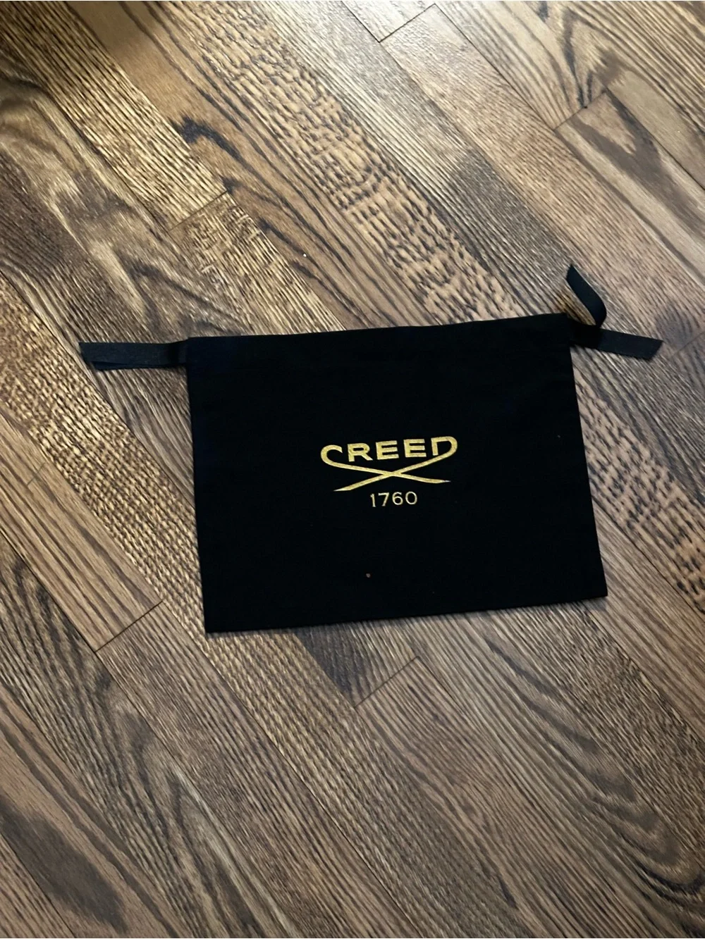 Creed Black Drawstring Pouch with Gold Logo
